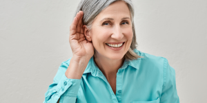 Woman holding ear up